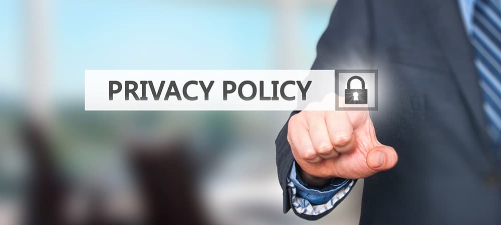 Businessman pressing Privacy Policy button on virtual screens